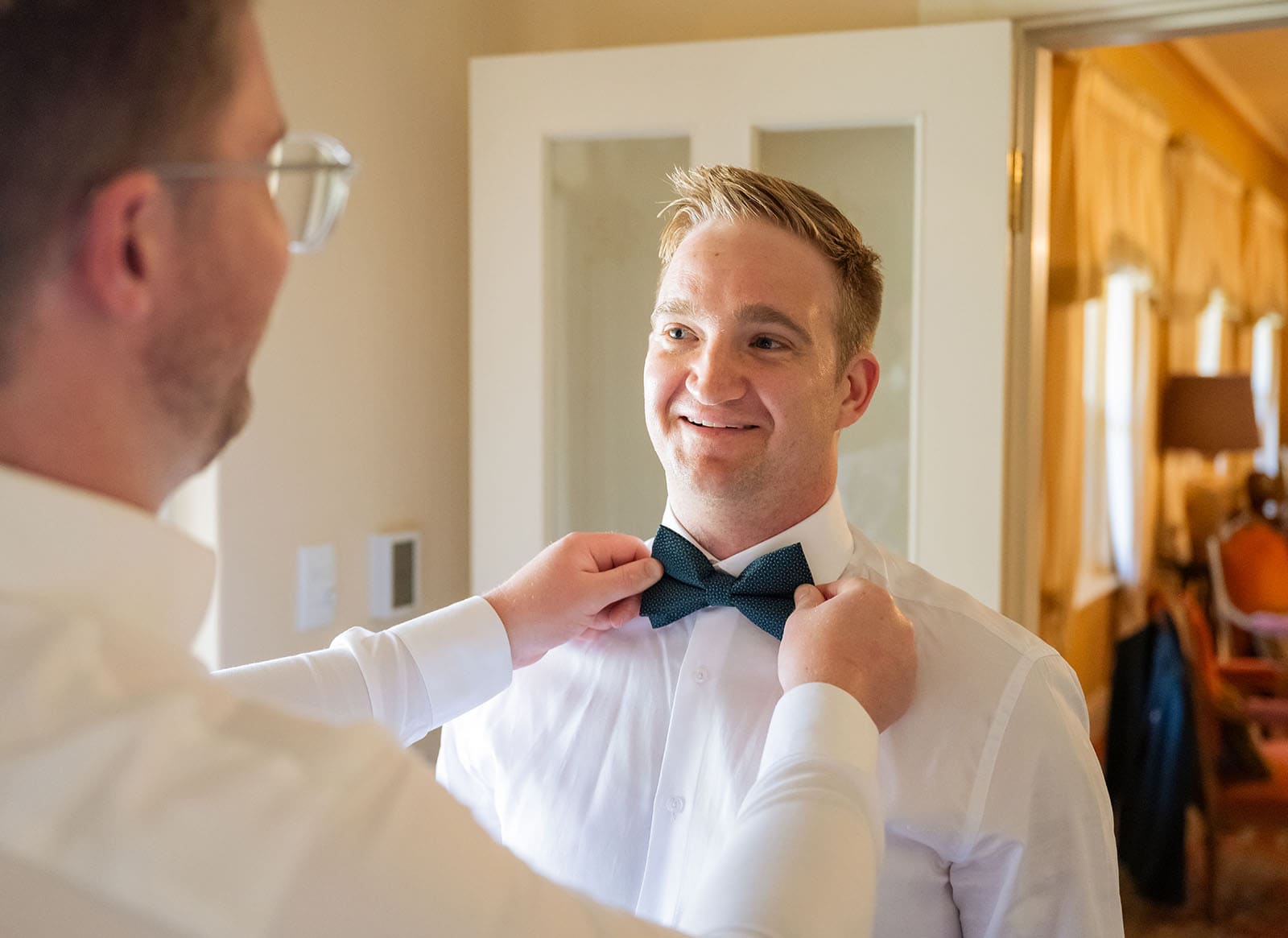 groom having tie checked Groom having tie checked